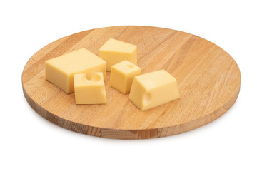 cheese cubes on a cutting board