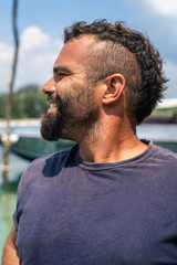 Fototapeta premium Smiling young man with mohawk and beard.
