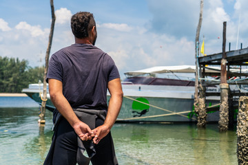 Young man in a wetsuit.