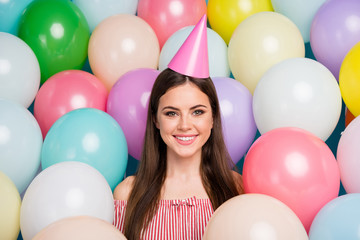 Fototapeta na wymiar Close-up portrait of her she nice attractive lovely lovable pretty charming winsome cute cheerful cheery long-haired girl wearing festal cap among colorful air balls