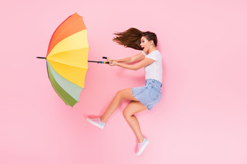 Top above high angle view full size profile side photo of astonished girl lay have walk impressed air wind blow parasol scream wear stylish clothes isolated over pastel color background © deagreez