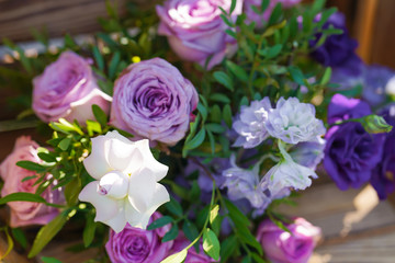 Bouquets of fresh flowers decoration of the festive table. Celebrating an open air party. Decor Details