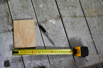tape measure on wooden surface