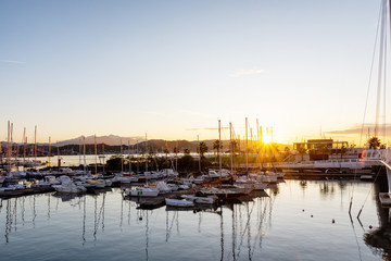 Dawn in the port of La Spezia, boats and yachts on sunrise background, Ligurian coast of Italy. 