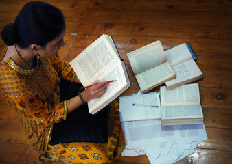 Indian student preparing for competitive exams during night hours.
