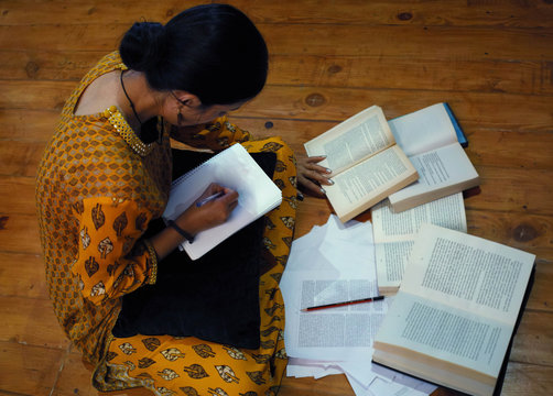 Indian Student Preparing For Entrance Exams During Late Night Hours