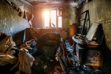 Obraz na płótnie Canvas Burnt house interior. Consequences of fire concept