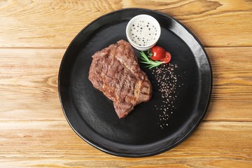 Generous piece of grilled steak with fat. Beef and noble meat