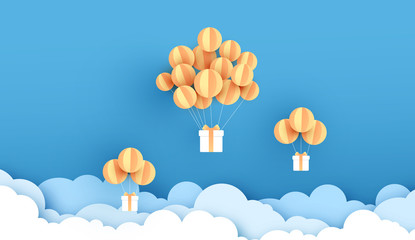 Balloons yellow floating on sky. Delivery service with Gift Box on air blue background.happy new years and merry Christmas.Festival transportation concept.Creative paper cut and craft style vector