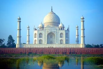 Fototapeta na wymiar The Taj Mahal is an ivory-white marble mausoleum on the south bank of the Yamuna river in the Indian city of Agra.