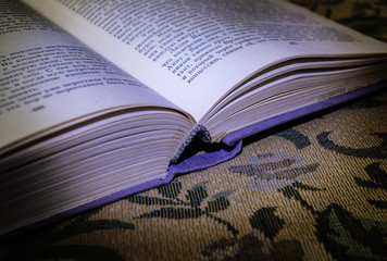 old book on a wooden table