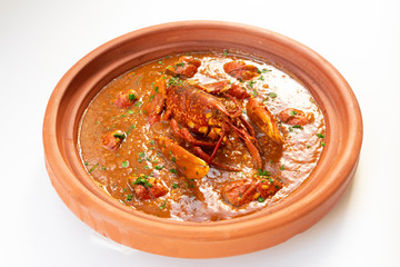 Lobster stew in a clay pot dish. Caldereta de bogavante