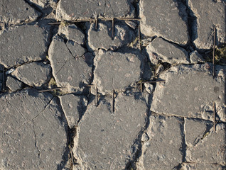 Fototapeta premium The texture of the broken road. Old building blocks. Background for screensaver monitor