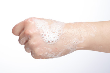 hands covered with soap bubbles.