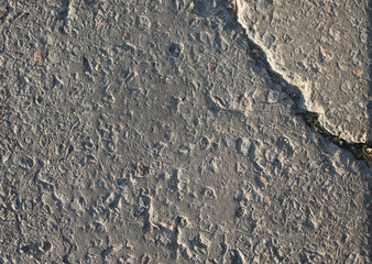 The texture of the broken road. Old building blocks. Background for screensaver monitor