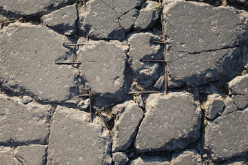The texture of the broken road. Old building blocks. Background for screensaver monitor