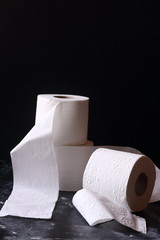 white toilet tissue ,paper on a  black background