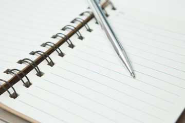 Selective focus of Pen, notebook  on white background