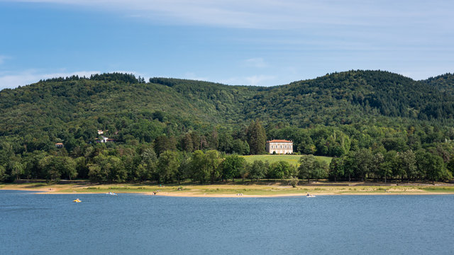 Beautiful French manor house sits with a spectacular view over a lake in southern France