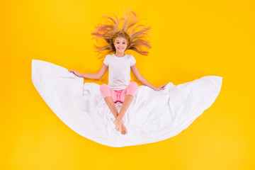 Top view above high angle flat lay flatlay lie concept of her she nice lovely cute cheerful cheery girl sitting on blanket like moon isolated bright vivid shine vibrant yellow color background
