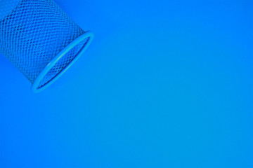 Blue background with metal cylindrical pen, space for text