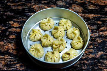 Nepalese traditional dumpling momos, Tibetan momo, Chinese dumpling dimsum on a momo pot