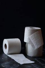 White toilet tissue, paper on a black background
