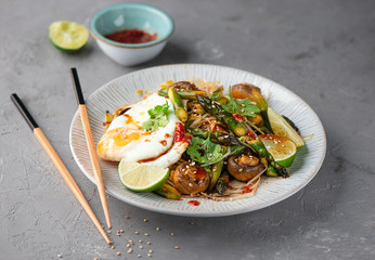 Wok with asparagus mushrooms and egg
