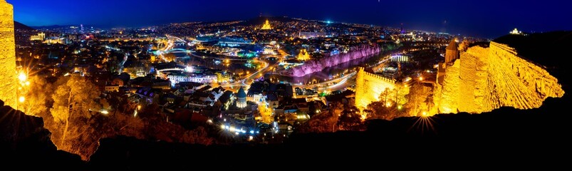 wide angle background image of  tbilisi panorama from Narikala fortress at night.Historical sites  in Georgia. Blank space. 2020 © Evaldas