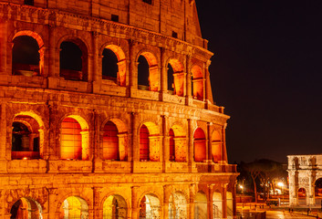 Obraz premium Colorful view of the Colosseum at night, Rome Italy.