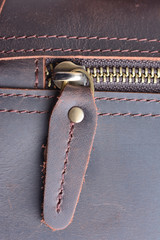 Zipper on leather bag close up