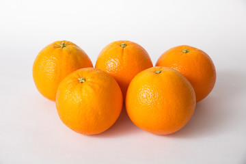 Set of whole orange fruits isolated on white background. High angle, closeup. Natural vitamin or organic food concept