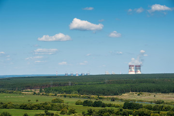 Fototapeta na wymiar Nuclear power station in a green field