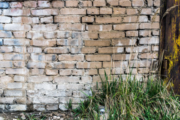 Background of an old, dirty, white brick wall with peeling plaster, painted walls, texture