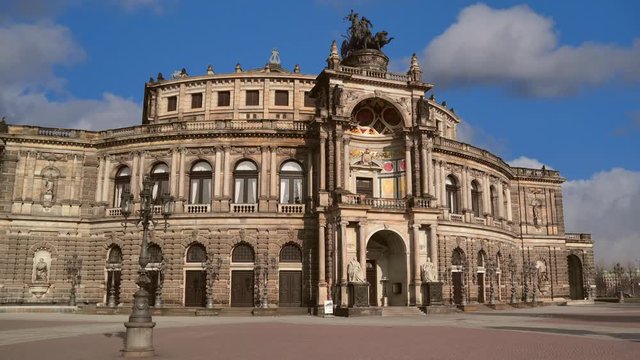 Time lapse shot of famous semper opera house with clouds and blue sky