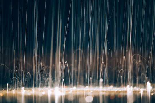 Abstract images of pouring rain in the night.