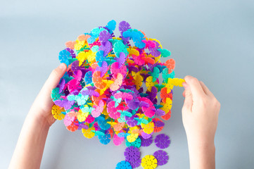 Little kid plays assemble with cubes constructor. Education concept for children learning. Children's toys.