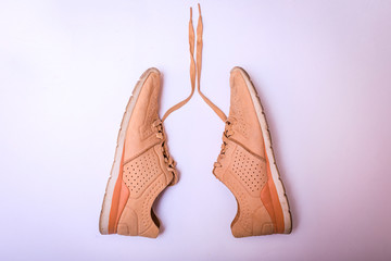 Sport stylish sneakers in form like a lungs. Run for lungs. Health care coneptual image.
