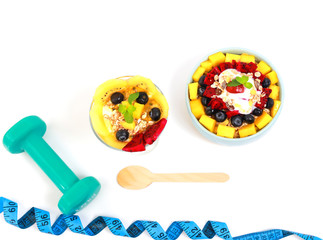 Top view of colors Delicious fruit, greek yogurt and granola parfaits on white background,Diet and healthy concept