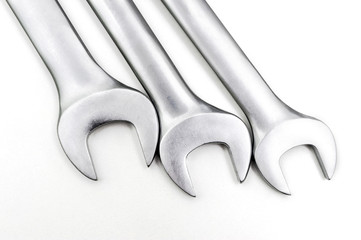 Spanner Set Isolated. Silver coloured spanners lying side by side in white background.