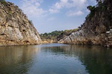 Fototapeta na wymiar Narmada river in between Marble Rocks, Jabalpur, Madhya Pradesh/India