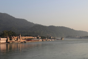 Fototapeta premium Panoramic view of the city Rishikesh India at the sunset