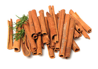 Cinnamon and rosemary on a white background