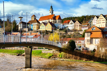 Houses of old town in black forest village Horb am Neckar behind water of neckar river, a beautiful scenery - obrazy, fototapety, plakaty
