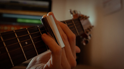  slide on fingerboard of acoustic guitar