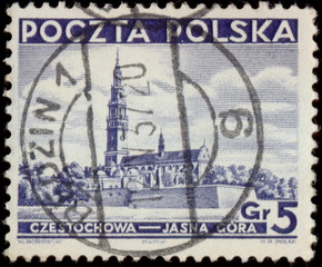 Będzin. Kasownik pocztowy (1937) odbity na znaczku pocztowym, przedstawiającym Klasztor na Jasnej Górze.