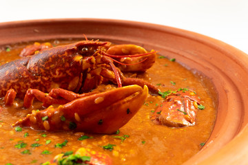 Lobster stew in a clay pot dish. Caldereta de bogavante