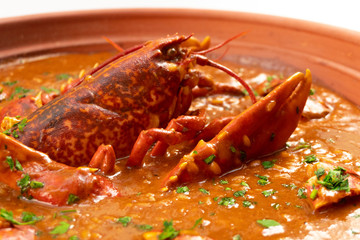 Lobster stew in a clay pot dish. Caldereta de bogavante