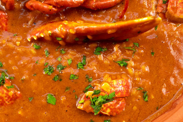 Lobster stew in a clay pot dish. Caldereta de bogavante