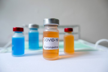 Professional doctors perform testing and analyzing samples of COVID-19 vaccines for immunization prevention and treatment from viral infections. Medical and health care concepts